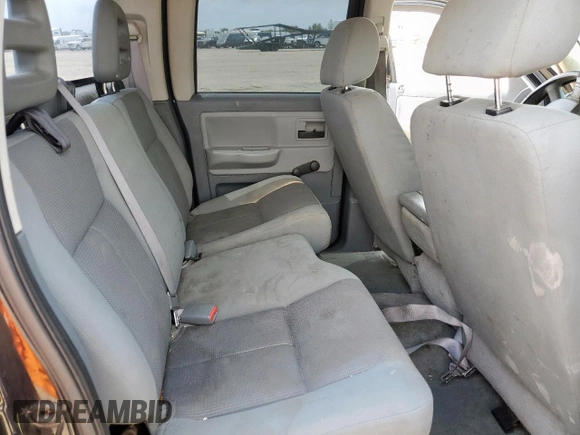 2005 Dodge Dakota ST z VIN 1D7HE28K35S235225, wystawiony jako Copart lot #57684725 z przebiegiem 184 546 mil mil oraz Szkoda całkowita • Salvage title. Historia ofert i sprzedaży dostępna na DreamBid. Obrazek 10.