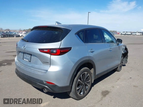 2023 Mazda CX-5 2.5 S Premium Package with VIN JM3KFBDM9P0173453, listed as a IAAI auction lot 41807979 with 34,156 mi miles. Bid and sale history available at carsss.com. Image 4.
