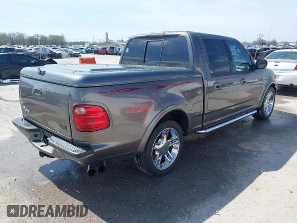 2002 Ford F-150 Harley Davidson with VIN 1FTRW07392KE11409, listed as a IAAI auction lot 41877998 with 148,476 mi miles. Bid and sale history available at carsss.com. Image 4.