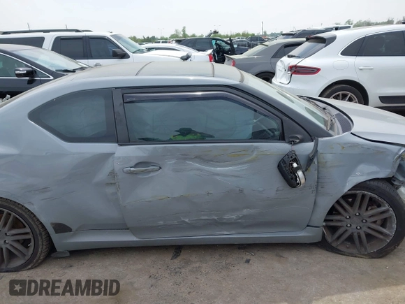 2013 Scion tC with VIN JTKJF5C7XD3046764, listed as a IAAI auction lot 41881930 with 87,701 mi miles. Bid and sale history available at carsss.com. Image 13.