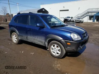 2005 Hyundai Tucson GL with VIN KM8JM72D55U167063, listed as a Copart auction lot 52002865 with 157,945 mi miles and Salvage Title. Bid and sale history available at carsss.com. Image 4.