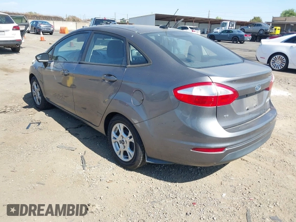 2014 Ford Fiesta SE z VIN 3FADP4BJ6EM117845, wystawiony jako IAAI lot #42431152 z przebiegiem 97 742 mil mil oraz . Historia ofert i sprzedaży dostępna na DreamBid. Obrazek 3.