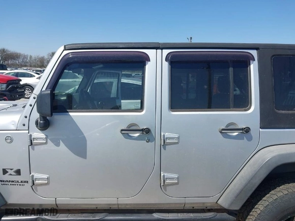 2007 Jeep Wrangler Unlimited X with VIN 1J4GA39197L161975, listed as a IAAI auction lot 41742409 with 270,227 mi miles. Bid and sale history available at carsss.com. Image 14.