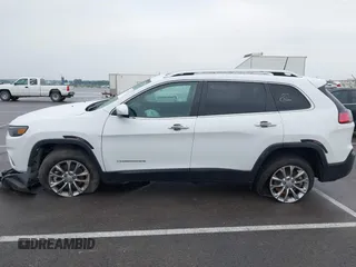 2021 Jeep Cherokee Latitude Lux z VIN 1C4PJMMX4MD221786, wystawiony jako IAAI lot #42432825 z przebiegiem 54 297 mil mil oraz . Historia ofert i sprzedaży dostępna na DreamBid. Obrazek 14.