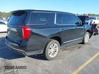 2021 GMC Yukon SLT with VIN 1GKS1BKD0MR199154, listed as a IAAI auction lot 41654239 with 105,357 mi miles. Bid and sale history available at carsss.com. Image 4.
