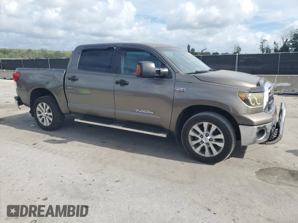2012 Toyota Tundra z VIN 5TFDW5F14CX216264, wystawiony jako Copart lot #60983285 z przebiegiem 186 869 mil mil oraz Szkoda całkowita • Salvage title. Historia ofert i sprzedaży dostępna na DreamBid. Obrazek 4.