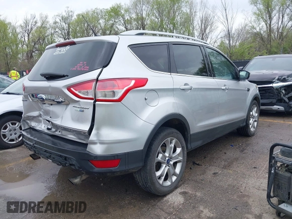 2015 Ford Escape Titanium with VIN 1FMCU9JX2FUA24279, listed as a IAAI auction lot 41930868 with 254,997 mi miles. Bid and sale history available at carsss.com. Image 4.