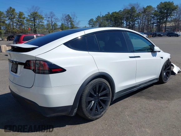 2022 Tesla Model X with VIN 7SAXCDE58NF342776, listed as a IAAI auction lot 42042369 with 70,301 mi miles and . Bid and sale history available at DreamBid. Image 4.