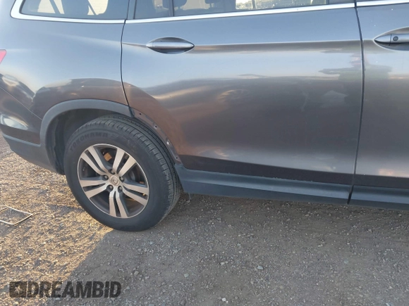 2017 Honda Pilot EX-L with VIN 5FNYF5H74HB010026, listed as a IAAI auction lot 41633770 with 170,383 mi miles and . Bid and sale history available at DreamBid. Image 19.