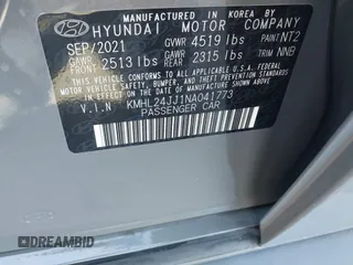2022 Hyundai Sonata Hybrid Blue with VIN KMHL24JJ1NA041773, listed as a IAAI auction lot 41043553 with 23,696 mi miles. Bid and sale history available at carsss.com. Image 9.