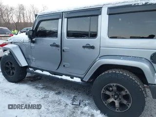 2015 Jeep Wrangler Unlimited Rubicon Hard Rock with VIN 1C4HJWFG1FL659803, listed as a IAAI auction lot 41172485 with 126,881 mi miles and . Bid and sale history available at DreamBid. Image 14.