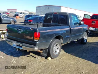 1998 Mazda B-Series 2WD Truck SX with VIN 4F4YR12C4WTM47743, listed as a IAAI auction lot 41430832 with 318,909 mi miles. Bid and sale history available at carsss.com. Image 4.