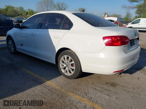 2012 Volkswagen Jetta Sedan SE w/Convenience & Sunroof with VIN 3VWDX7AJ4CM386885, listed as a IAAI auction lot 42052411 with 328,232 mi miles. Bid and sale history available at carsss.com. Image 3.