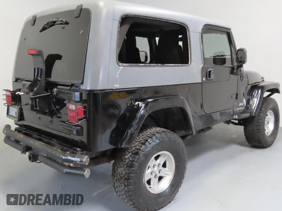 2005 Jeep Wrangler Unlimited with VIN 1J4FA44S75P305935, listed as a Copart auction lot 65582205 with 116,569 mi miles and Salvage title. Bid and sale history available at DreamBid. Image 3.