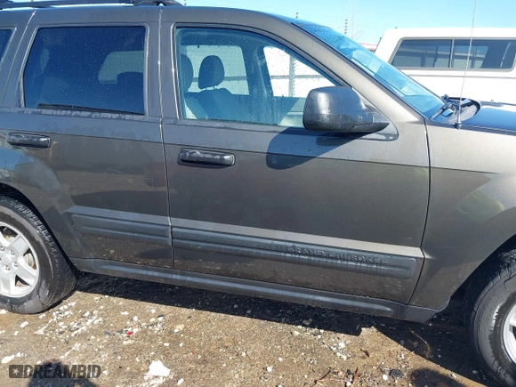 2006 Jeep Grand Cherokee Laredo with VIN 1J4GR48K56C326847, listed as a IAAI auction lot 41972623 with 141,088 mi miles. Bid and sale history available at carsss.com. Image 14.