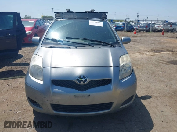 2009 Toyota Yaris with VIN JTDKT903195235991, listed as a IAAI auction lot 42164989 with 249,389 mi miles. Bid and sale history available at carsss.com. Image 6.