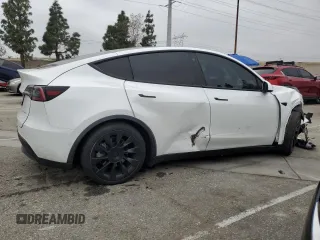 2021 Tesla Model Y Long Range with VIN 5YJYGDEE3MF214823, listed as a Copart auction lot 50738045 with 63,227 mi miles and Salvage Title. Bid and sale history available at DreamBid. Image 3.