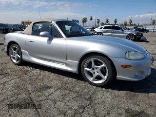 2003 Mazda MX-5 Miata Cloth z VIN JM1NB353430301685, wystawiony jako Copart lot #48756715 z przebiegiem 57 414 mil mil oraz Szkoda całkowita • Salvage title. Historia ofert i sprzedaży dostępna na DreamBid. Obrazek 4.