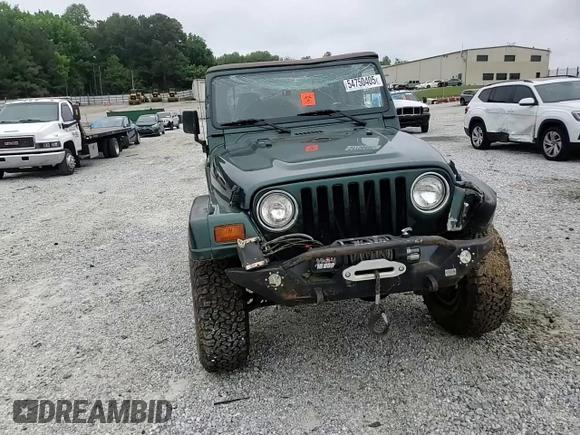 1999 Jeep Wrangler Sahara with VIN 1J4FY49S0XP489462, listed as a Copart auction lot 54750405 with 134,134 mi miles and Non repairable. Bid and sale history available at DreamBid. Image 13.