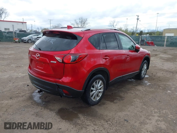 2014 Mazda CX-5 Touring z VIN JM3KE2CY3E0424892, wystawiony jako IAAI lot #42016801 z przebiegiem 173 350 mil mil oraz . Historia ofert i sprzedaży dostępna na DreamBid. Obrazek 4.