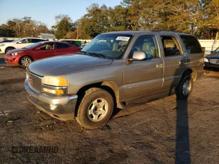 2003 GMC Yukon SLT with VIN 1GKEC13V23R303134, listed as a Copart auction lot 84398664 with 392,041 mi miles and Salvage Title. Bid and sale history available at carsss.com. Image 1.