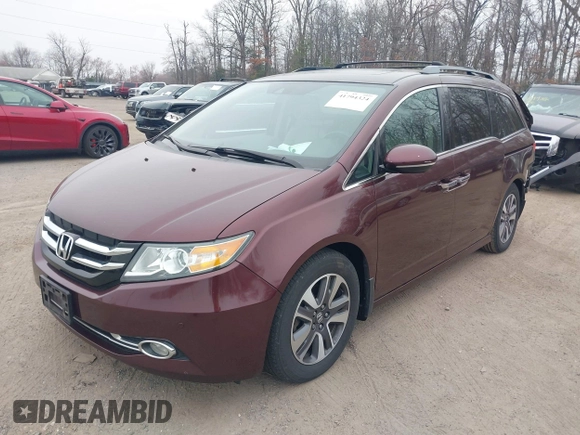 2014 Honda Odyssey Touring with VIN 5FNRL5H97EB117971, listed as a IAAI auction lot 41794324 with 198,191 mi miles and . Bid and sale history available at DreamBid. Image 2.