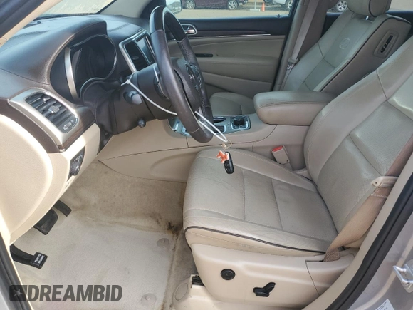 2016 Jeep Grand Cherokee Overland with VIN 1C4RJFCT2GC320247, listed as a Copart auction lot 50832195 with 104,300 mi miles and Salvage title. Bid and sale history available at DreamBid. Image 7.