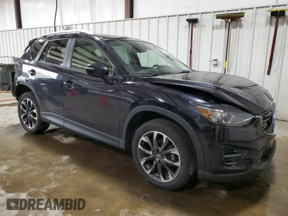 2016 Mazda CX-5 Grand Touring with VIN JM3KE4DY2G0738899, listed as a Copart auction lot 50943255 with 80,807 mi miles and Salvage Title. Bid and sale history available at carsss.com. Image 4.