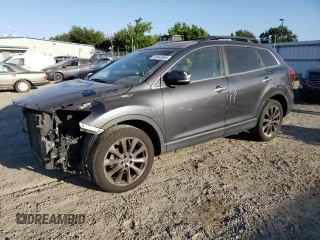 2015 Mazda CX-9 Grand Touring z VIN JM3TB3DV2F0456130, wystawiony jako Copart lot #60545095 z przebiegiem 120 892 mil mil oraz Szkoda całkowita • Salvage title. Historia ofert i sprzedaży dostępna na DreamBid. Obrazek 1.