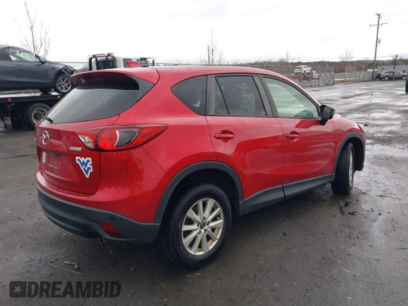 2014 Mazda CX-5 Touring with VIN JM3KE2CY2E0322211, listed as a IAAI auction lot 41721219 with 127,312 mi miles. Bid and sale history available at carsss.com. Image 4.