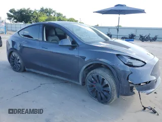 2022 Tesla Model Y Performance with VIN 7SAYGDEF8NF384270, listed as a Copart auction lot 56718215 with Not provided miles and Salvage title. Bid and sale history available at DreamBid. Image 4.