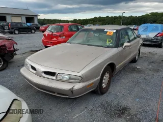 1998 Oldsmobile 88 LS z VIN 1G3HN52K0W4857890, wystawiony jako Copart lot #56019374 z przebiegiem 170 105 mil mil oraz Szkody całkowita. Historia ofert i sprzedaży dostępna na DreamBid. Obrazek 2.