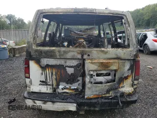 2001 Chevrolet Astro with VIN 1GNDM19W41B133828, listed as a Copart auction lot 71956404 with Not Provided miles and Salvage Title. Bid and sale history available at carsss.com. Image 6.