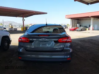 2015 Ford Focus SE z VIN 1FADP3F21FL210742, wystawiony jako IAAI lot #42418476 z przebiegiem 155 829 mil mil oraz . Historia ofert i sprzedaży dostępna na DreamBid. Obrazek 16.