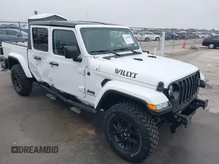 2021 Jeep Gladiator Willys with VIN 1C6HJTAG1ML575474, listed as a IAAI auction lot 41439898 with 44,335 mi miles and . Bid and sale history available at DreamBid. Image 1.
