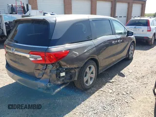 2020 Honda Odyssey EX with VIN 5FNRL6H59LB068868, listed as a IAAI auction lot 41930832 with 64,872 mi miles and . Bid and sale history available at DreamBid. Image 4.