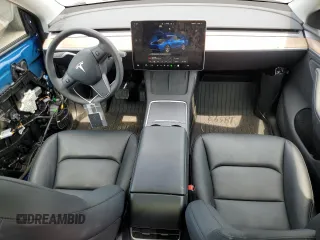 2024 Tesla Model Y Long Range z VIN 7SAYGDEE8RA248635, wystawiony jako Copart lot #59130125 z przebiegiem 21 210 mil mil oraz Szkoda całkowita • Salvage title. Historia ofert i sprzedaży dostępna na DreamBid. Obrazek 8.