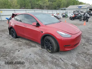 2023 Tesla Model Y Long Range z VIN 7SAYGAEE1PF690008, wystawiony jako Copart lot #54441735 z przebiegiem 38 291 mil mil oraz Szkody całkowita. Historia ofert i sprzedaży dostępna na DreamBid. Obrazek 4.