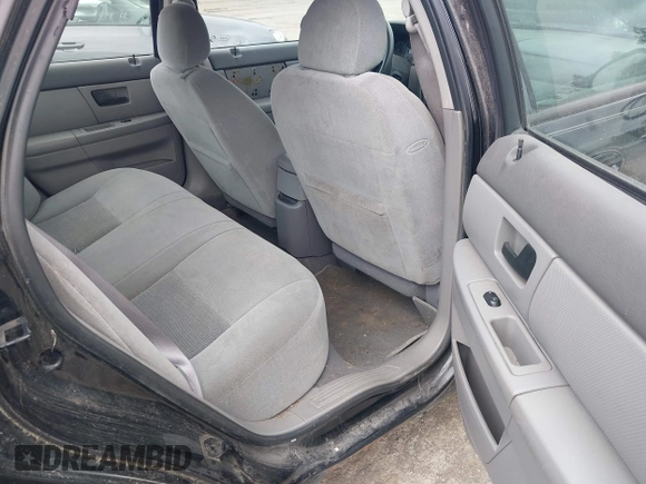 2005 Ford Taurus SE z VIN 1FAHP53U75A109055, wystawiony jako IAAI lot #42401043 z przebiegiem Nie podano mil oraz . Historia ofert i sprzedaży dostępna na DreamBid. Obrazek 8.