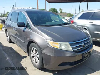 2012 Honda Odyssey EX-L with VIN 5FNRL5H65CB012428, listed as a IAAI auction lot 42164272 with 256,253 mi miles and . Bid and sale history available at carsss.com. Image 1.