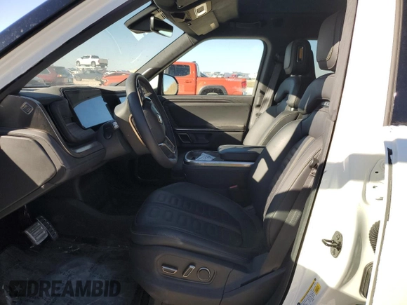 2023 Rivian R1S Adventure with VIN 7PDSGBBA4PN022157, listed as a Copart auction lot 81359984 with 13,522 mi miles and Salvage Title. Bid and sale history available at DreamBid. Image 7.