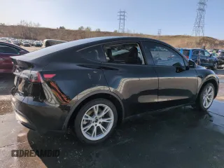2023 Tesla Model Y Long Range with VIN 7SAYGDEE5PF850358, listed as a Copart auction lot 52581615 with 19,376 mi miles and Salvage Title. Bid and sale history available at DreamBid. Image 3.