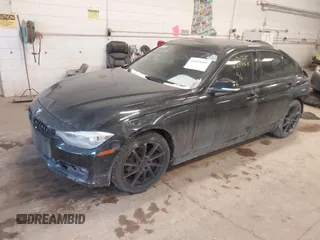 2013 BMW 3 Series 328i xDrive with VIN WBA3B5G57DNS02815, listed as a IAAI auction lot 41643602 with 162,895 mi miles. Bid and sale history available at carsss.com. Image 2.