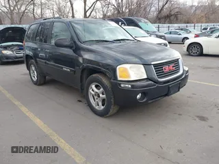 2005 GMC Envoy SLT with VIN 1GKDT13S352258833, listed as a IAAI auction lot 41525149 with 213,829 mi miles. Bid and sale history available at carsss.com. Image 1.