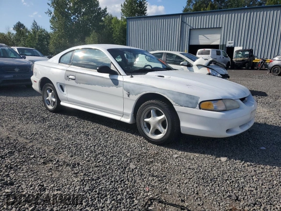 1997 Ford Mustang with VIN 1FALP4042VF119326, listed as a Copart auction lot 69286674 with 120,842 mi miles and Salvage Title. Bid and sale history available at carsss.com. Image 4.