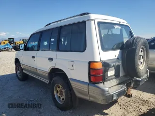 1995 Mitsubishi Montero z VIN JA4MR41H3SJ004800, wystawiony jako Copart lot #72036354 z przebiegiem 209 635 mil mil oraz Szkody całkowita. Historia ofert i sprzedaży dostępna na DreamBid. Obrazek 2.