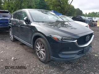 2019 Mazda CX-5 Grand Touring with VIN JM3KFBDM9K0667983, listed as a IAAI auction lot 42541336 with 102,362 mi miles and . Bid and sale history available at DreamBid. Image 1.