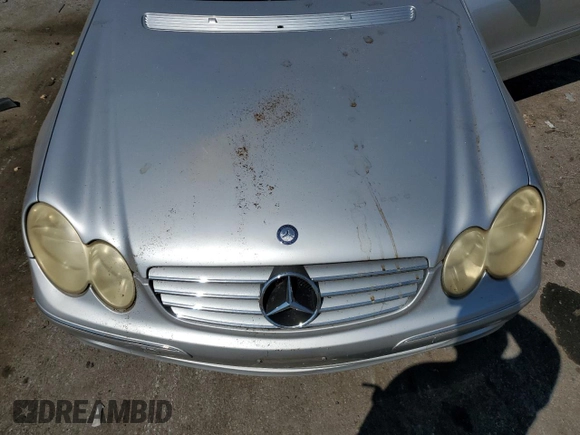 2004 Mercedes-Benz CLK 320 z VIN WDBTK65G74T030020, wystawiony jako Copart lot #69004654 z przebiegiem Nie podano mil oraz Szkody całkowita. Historia ofert i sprzedaży dostępna na DreamBid. Obrazek 11.
