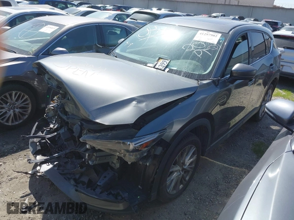2020 Mazda CX-5 Grand Touring with VIN JM3KFADM7L0766278, listed as a IAAI auction lot 41297902 with 1 mi miles. Bid and sale history available at carsss.com. Image 22.