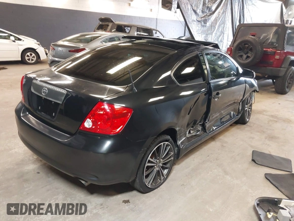 2010 Scion tC with VIN JTKDE3B77A0320585, listed as a IAAI auction lot 39883404 with 140,409 mi miles. Bid and sale history available at carsss.com. Image 4.